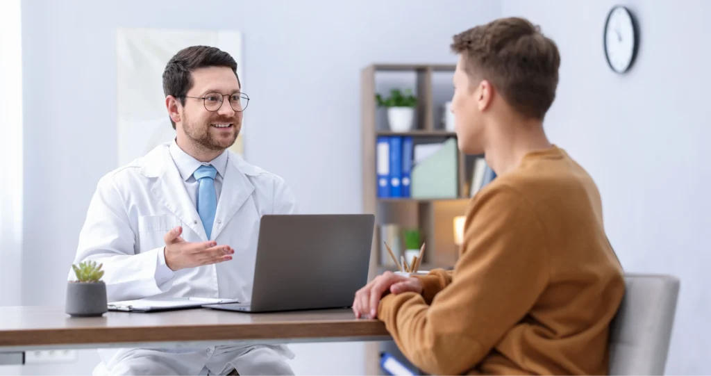 Dr Yasser Mehrez in consultation with a patient at his Harley Street pain clinic.